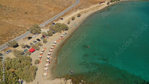 Aerial drone photo of famous calm turquoise sea sandy beaches of Steno next to small chapel of Agios Mamas, Astypalaia island, Dodecanese, Greece