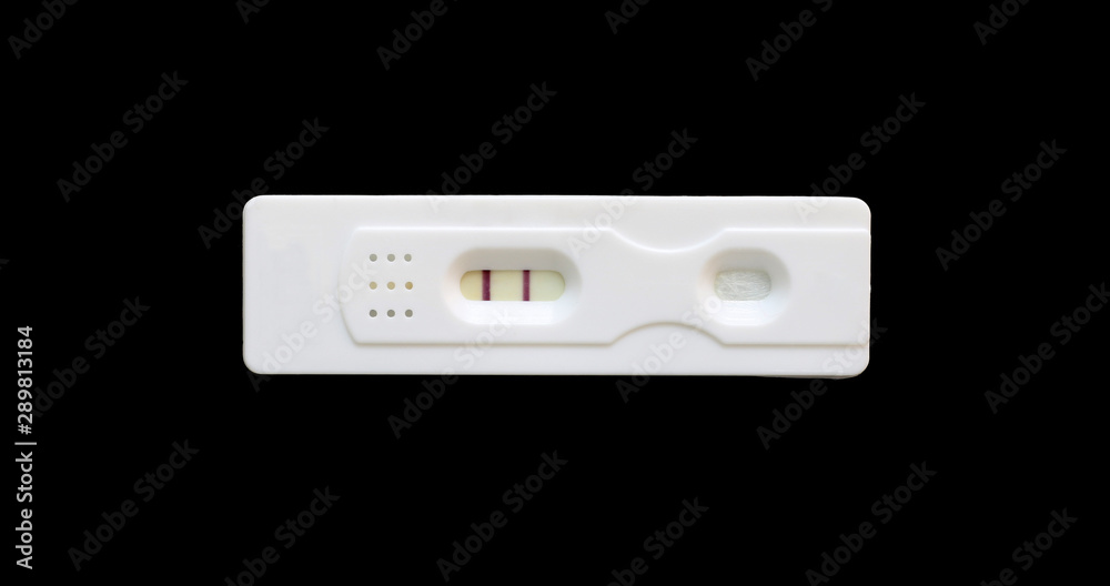 pregnancy test kit showing two lines isolated on black background Stock  Photo | Adobe Stock
