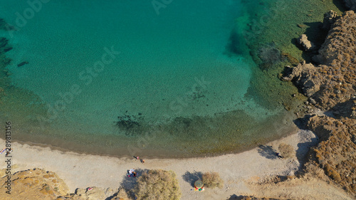 Aerial drone photo of famous calm turquoise sea sandy beaches of Steno next to small chapel of Agios Mamas, Astypalaia island, Dodecanese, Greece photo