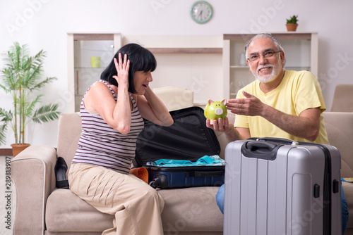 Old couple preparing for vacation travel