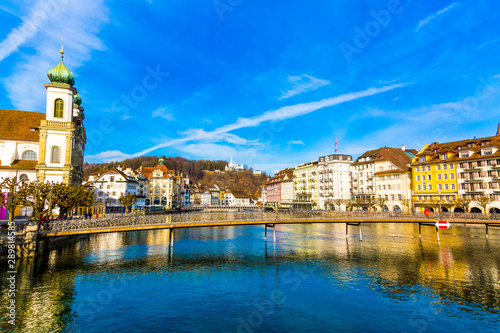 Old town buildings and bridge over River Reuss in Lucerne city in Switzerland