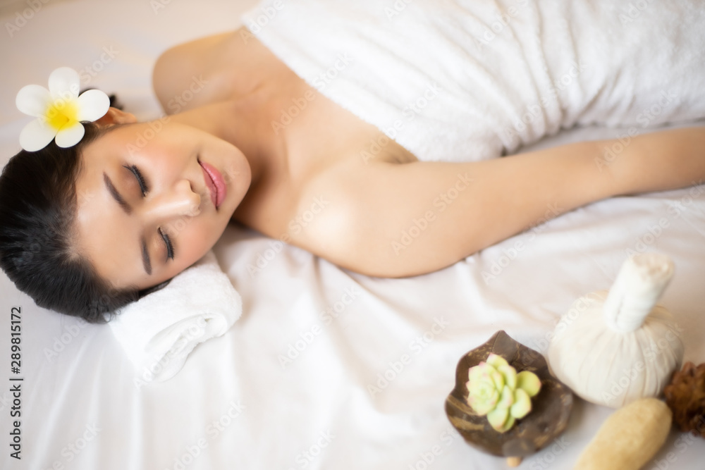 Asian Beautiful, young and healthy woman in spa salon. Massage treatment spa room . Traditional medicine and healing concept. Asian Beautiful, young and healthy woman in spa salon. Massage treatment spa room . Traditional medicine and healing concept.
