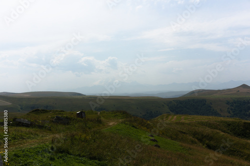 Lush green lawns meadows and mountains above 2000 m on the gumbashi pass in the northern caucasus between dombay and kislowodsk, raw original picture photo