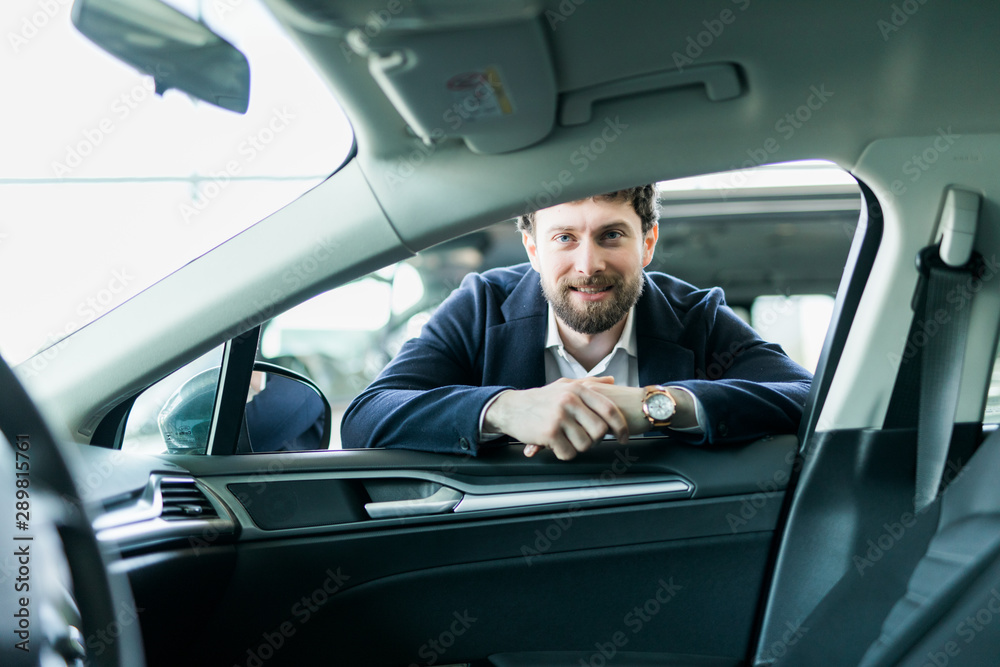 First test drive. Handsome young man ready to make first test drive First test drive. Handsome young man ready to make first test drive