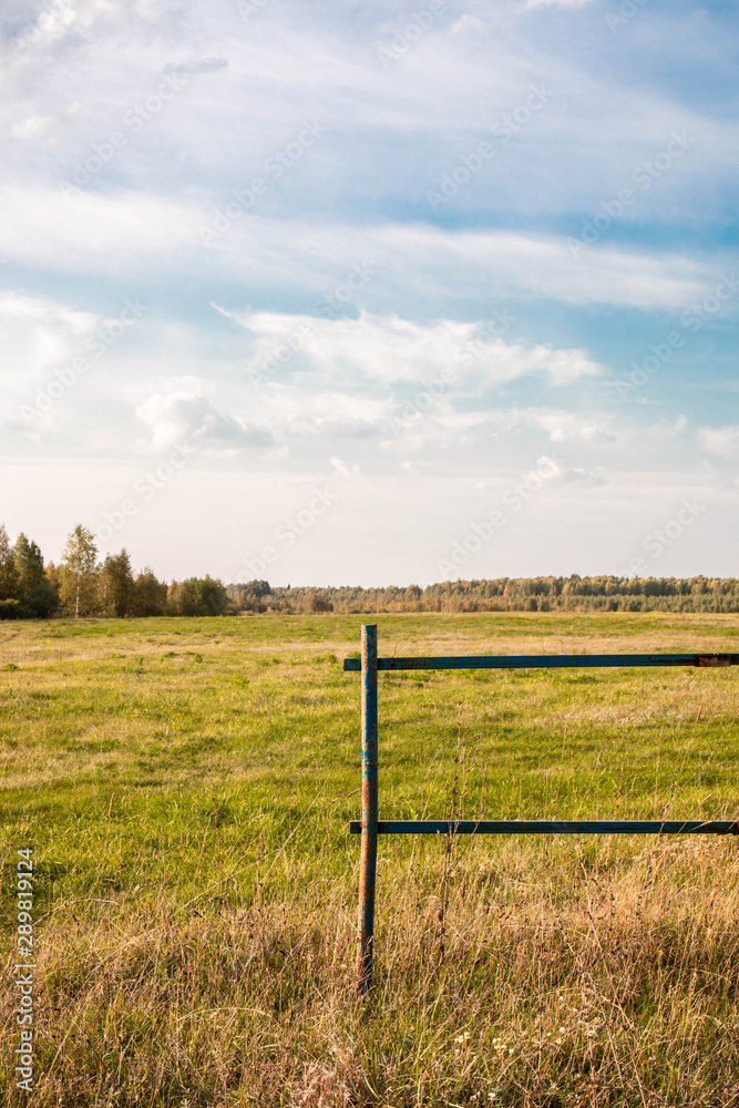 rural landscape with fence and blue sky rural landscape with fence and blue sky