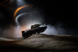 War Concept. Military silhouettes fighting scene on war fog sky background, Silhouette of armored vehicle below Cloudy Skyline At night. Attack scene. Tanks battle.
