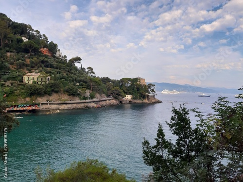 Portofino, Italy - 08/29/2019: Beautiful bay with colorful houses in Portofino in sumer days. Hiking around the ligurian mountains with amazing panoramic view.
