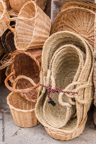 Wicker hand-made baskets at the shop of a touristic street of Segovia Castilla and Leon Spain.