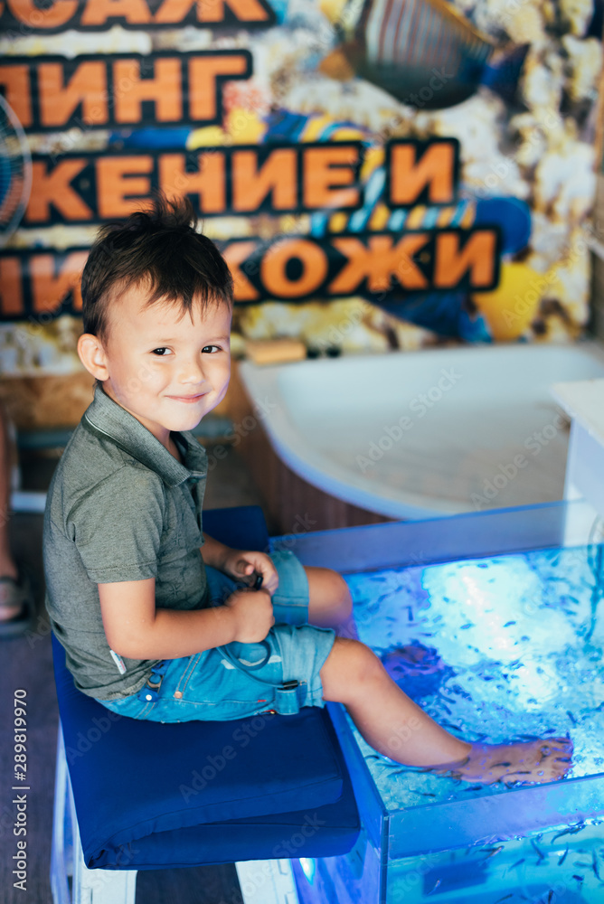 little boy feet in fish tank, Wellness, pedicure, foot massage, Stock ...