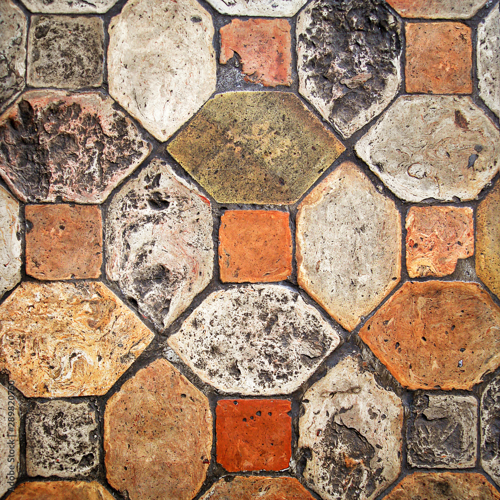 Ancient stone floor in warm tones Ancient stone floor in warm tones