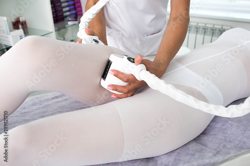 woman receiving lpg massage against cellulite on her legs. Massage for lifting body