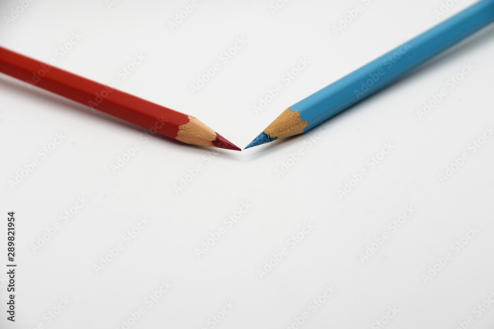 Red and blue colored pencils isolated on white background Red and blue colored pencils isolated on white background