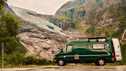Camper van and Boyabreen Glacier in Norway