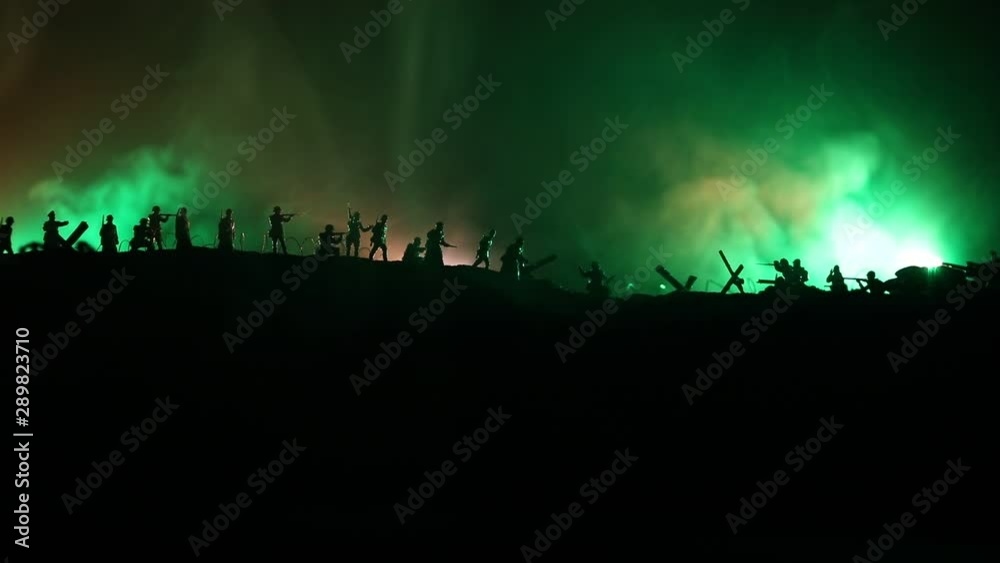 War Concept. Military silhouettes fighting scene on war fog sky background. Attack scene. Armored vehicles and infantry. Creative composition War Concept. Military silhouettes fighting scene on war fog sky background. Attack scene. Armored vehicles and infantry. Creative composition