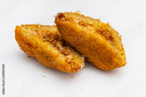 Obraz na płótnie Sicilian Arancino or Arancina. A typical Sicilian street food. w salonie