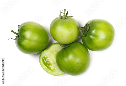 Half green unripe tomatoes isolated on white background, top view