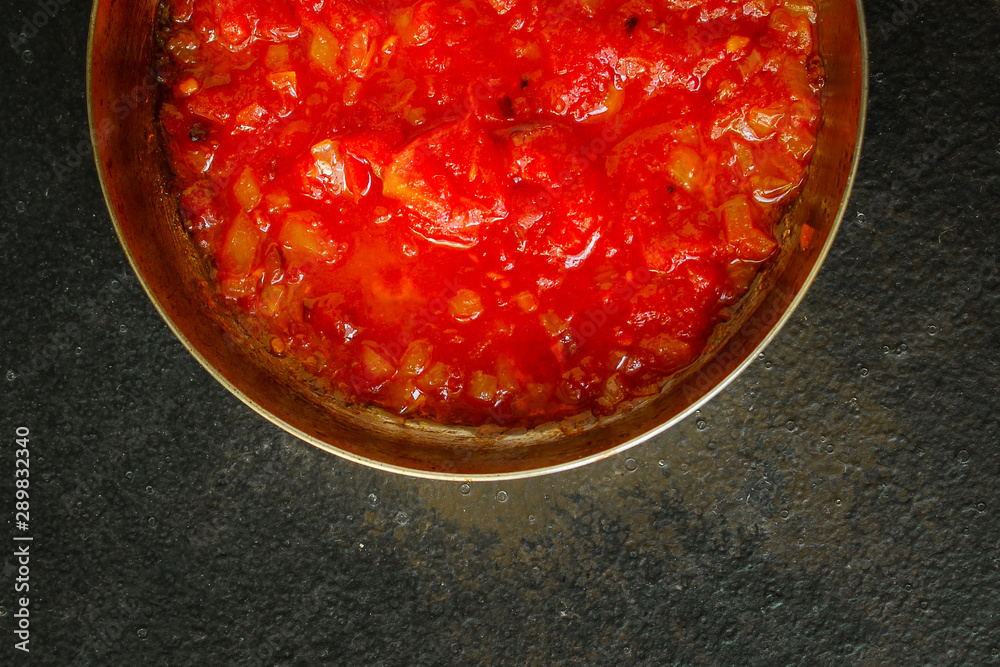 tomato sauce, skinless tomatoes - red and ripe fruits chopped, concept. food background. copy space
