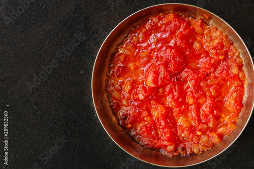 tomato sauce, skinless tomatoes - red and ripe fruits chopped, concept. food background. copy space
