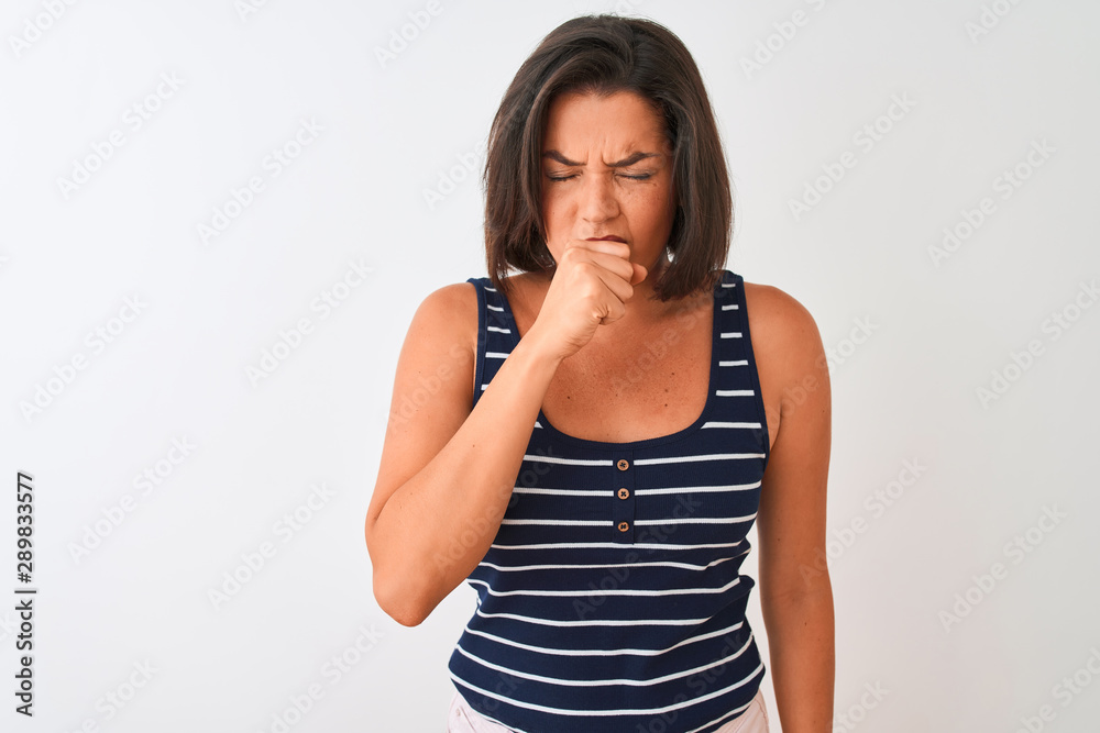 Young beautiful woman wearing blue striped t-shirt standing over isolated white background feeling unwell and coughing as symptom for cold or bronchitis. Healthcare concept. Young beautiful woman wearing blue striped t-shirt standing over isolated white background feeling unwell and coughing as symptom for cold or bronchitis. Healthcare concept.