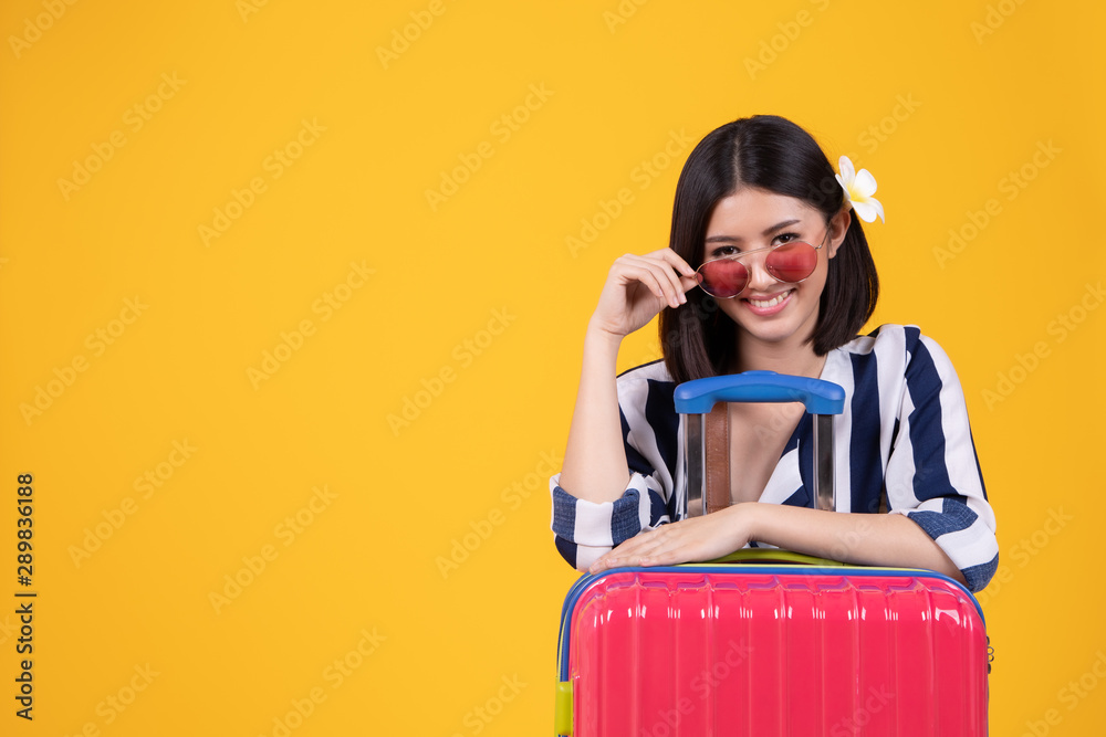 Tourist woman in summer casual clothes.Asian Smiling woman .Passenger traveling abroad to travel on colour background.Asian woman going to summer vacation.Travel trip funny. Tourist woman in summer casual clothes.Asian Smiling woman .Passenger traveling abroad to travel on colour background.Asian woman going to summer vacation.Travel trip funny.