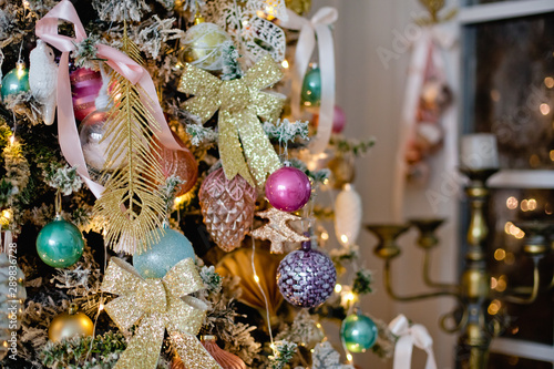 festively decorated Christmas tree Golden bow ribbons and balls