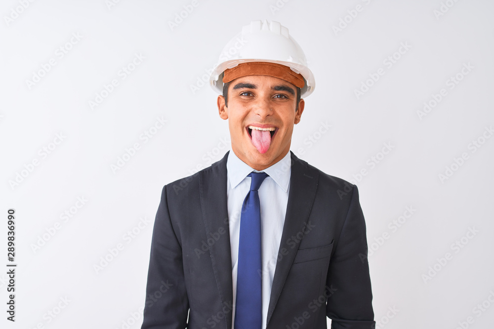 Young handsome architect man wearing suit and helmet over isolated white background sticking tongue out happy with funny expression. Emotion concept. Young handsome architect man wearing suit and helmet over isolated white background sticking tongue out happy with funny expression. Emotion concept.