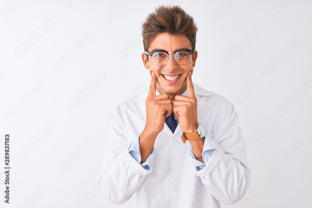 Young handsome sciencist man wearing glasses and coat over isolated white background Smiling with open mouth, fingers pointing and forcing cheerful smile