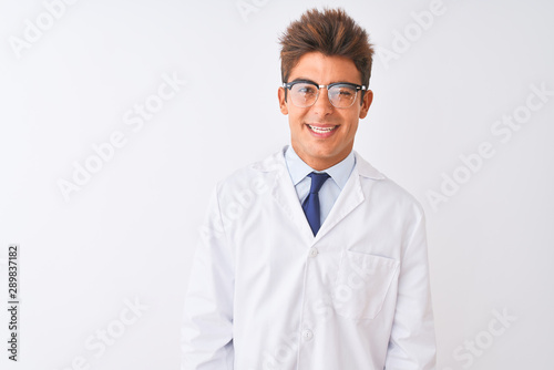 Young handsome sciencist man wearing glasses and coat over isolated white background winking looking at the camera with sexy expression, cheerful and happy face.
