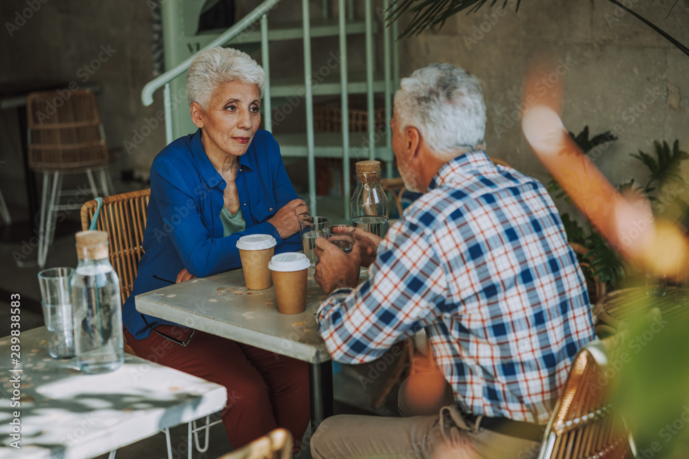 Mature couple drinking coffee in the cafe stock photo