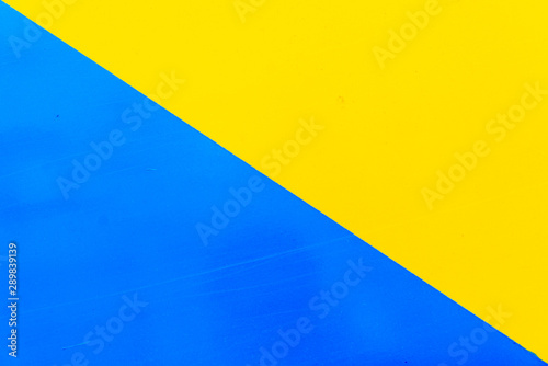 two colors separated by diagonal on metal background