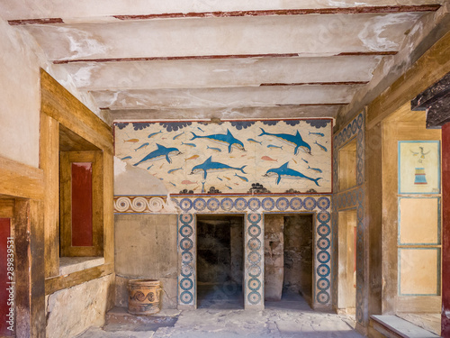 Old walls with Dolphin fresco, symbol of minoan culture. Knossos palace ruins at Crete island, Greece. Famous Minoan palace of Knossos