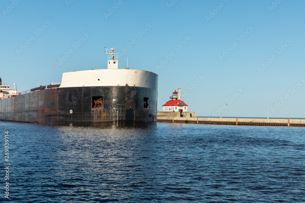 A Ship Passing A Lighthouse