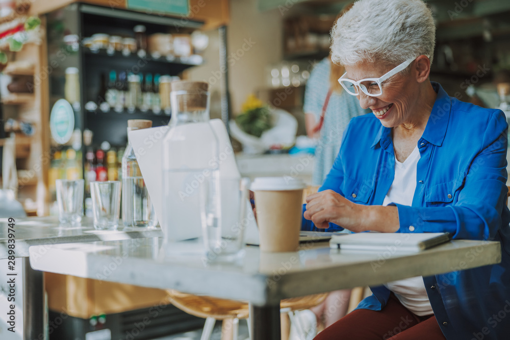 Mirthful lady laughing while working stock photo Mirthful lady laughing while working stock photo