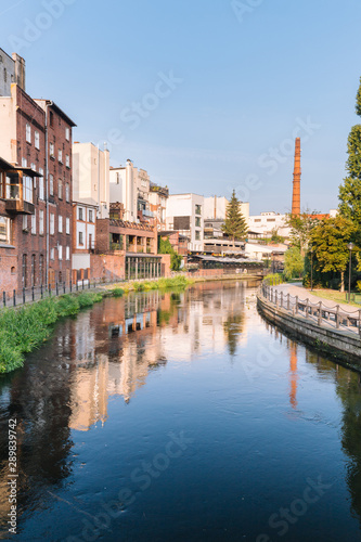Bydgoszcz in Poland.  Picturesque channels of the Brda River flowing through the city center.  Old historic factory and residential buildings stand along the river