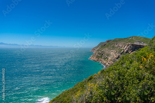 Summer landscape with cliff shore and beautiful ocean