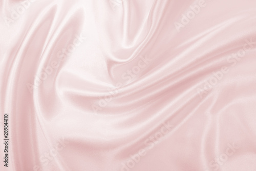 Delicate satin draped fabric pink texture for festive backgrounds