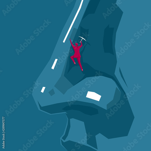 Businessman rock climbing on a huge face. The background is blue.