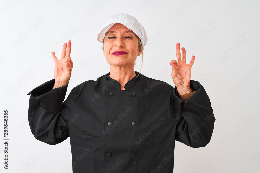 Middle age chef woman wearing uniform and cap standing over isolated white background relax and smiling with eyes closed doing meditation gesture with fingers. Yoga concept. Middle age chef woman wearing uniform and cap standing over isolated white background relax and smiling with eyes closed doing meditation gesture with fingers. Yoga concept.