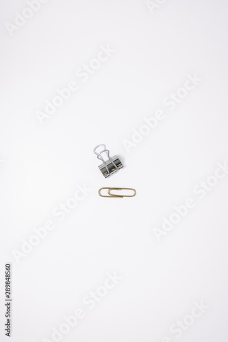 Silver Binder Clip and Gold Paperclip © Julio