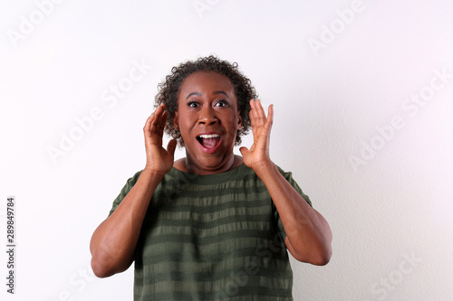 Portrait of happy African-American woman on white background