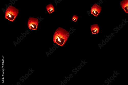 Flying Paper Sky Lantern On Diwali. Sky lanterns isolated on Black background with copy space. Diwali and New Year festival floating lamps at night sky.