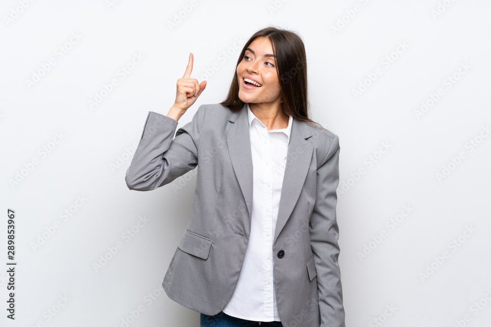 Young business woman over isolated white background intending to realizes the solution while lifting a finger up Young business woman over isolated white background intending to realizes the solution while lifting a finger up