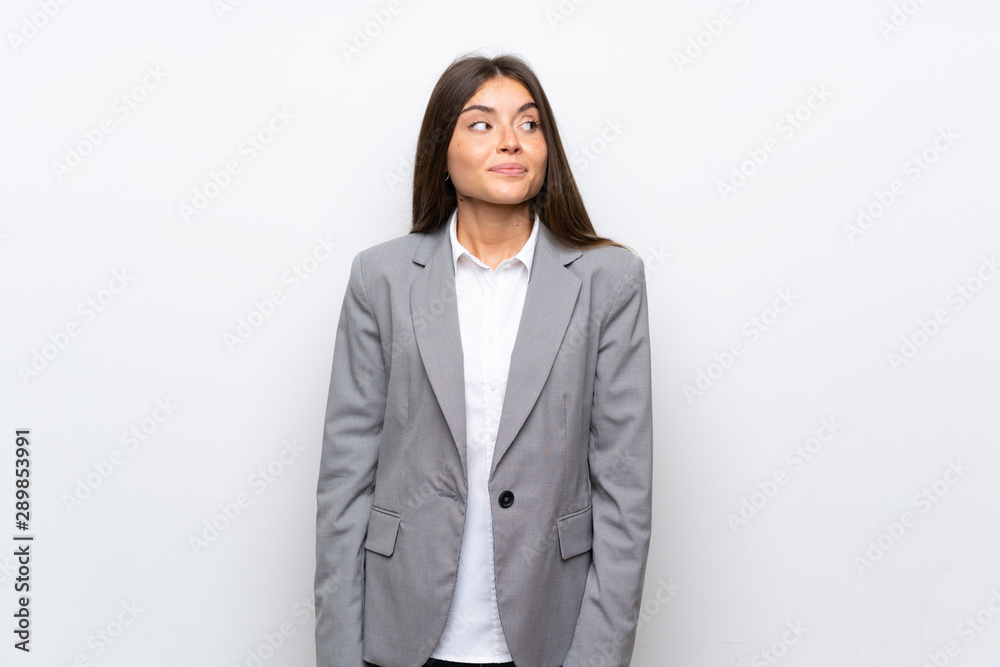 Young business woman over isolated white background making doubts gesture looking side Young business woman over isolated white background making doubts gesture looking side