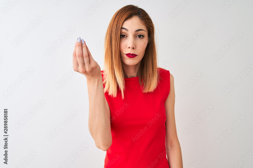Redhead businesswoman wearing elegant red dress standing over isolated white background Doing Italian gesture with hand and fingers confident expression Redhead businesswoman wearing elegant red dress standing over isolated white background Doing Italian gesture with hand and fingers confident expression