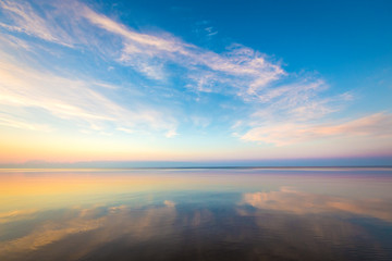 Seascape with colorful evening sky. Natural background. Beautiful sunset over the sea in the Atlantic ocean.