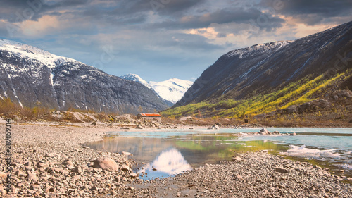 Jostedalsbreen National Park.  near the village of Gaupne in the Jostedalen Valley, Norway, Europe.Natural landscape, turquoise glacial lake among the stones on the high mountain near  Glacier Nigards photo