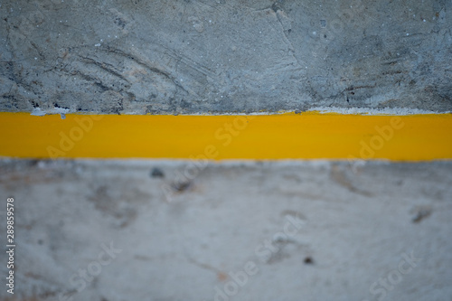 Yellow lines on cement road