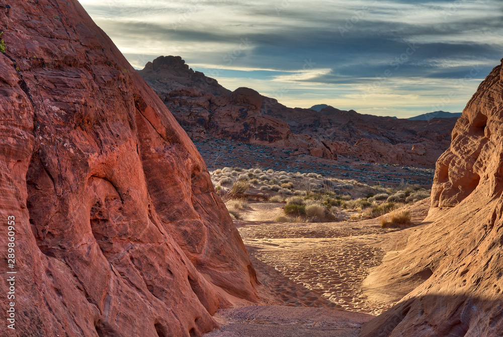 Opening in sandy Hiking trail in desert rocks Opening in sandy Hiking trail in desert rocks