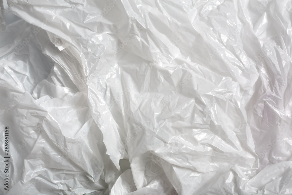 Obraz premium white plastic bag on white background. A White Plastic Bag Texture, macro, background. Reduction of plastic bags for natural treatment. The symbol of the campaign to refrain from using plastic bags.