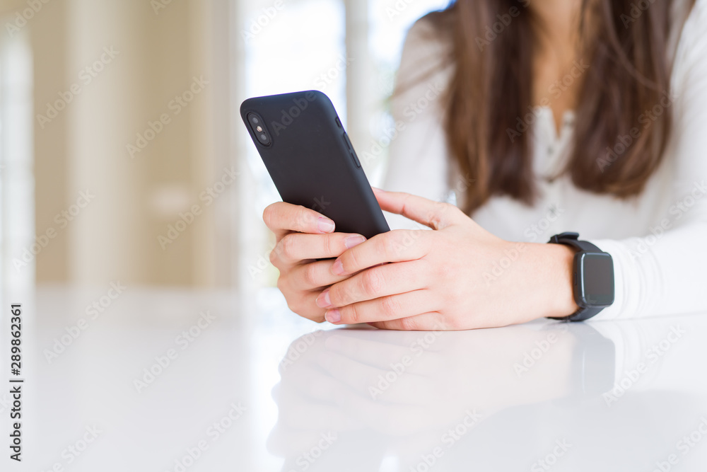 Close up of young woman using smartphone